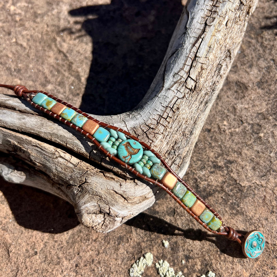 Turquoise and matte gold bird bracelet